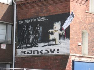 Banksy MIld Mild West and poster 300x225 Purplefrog Property